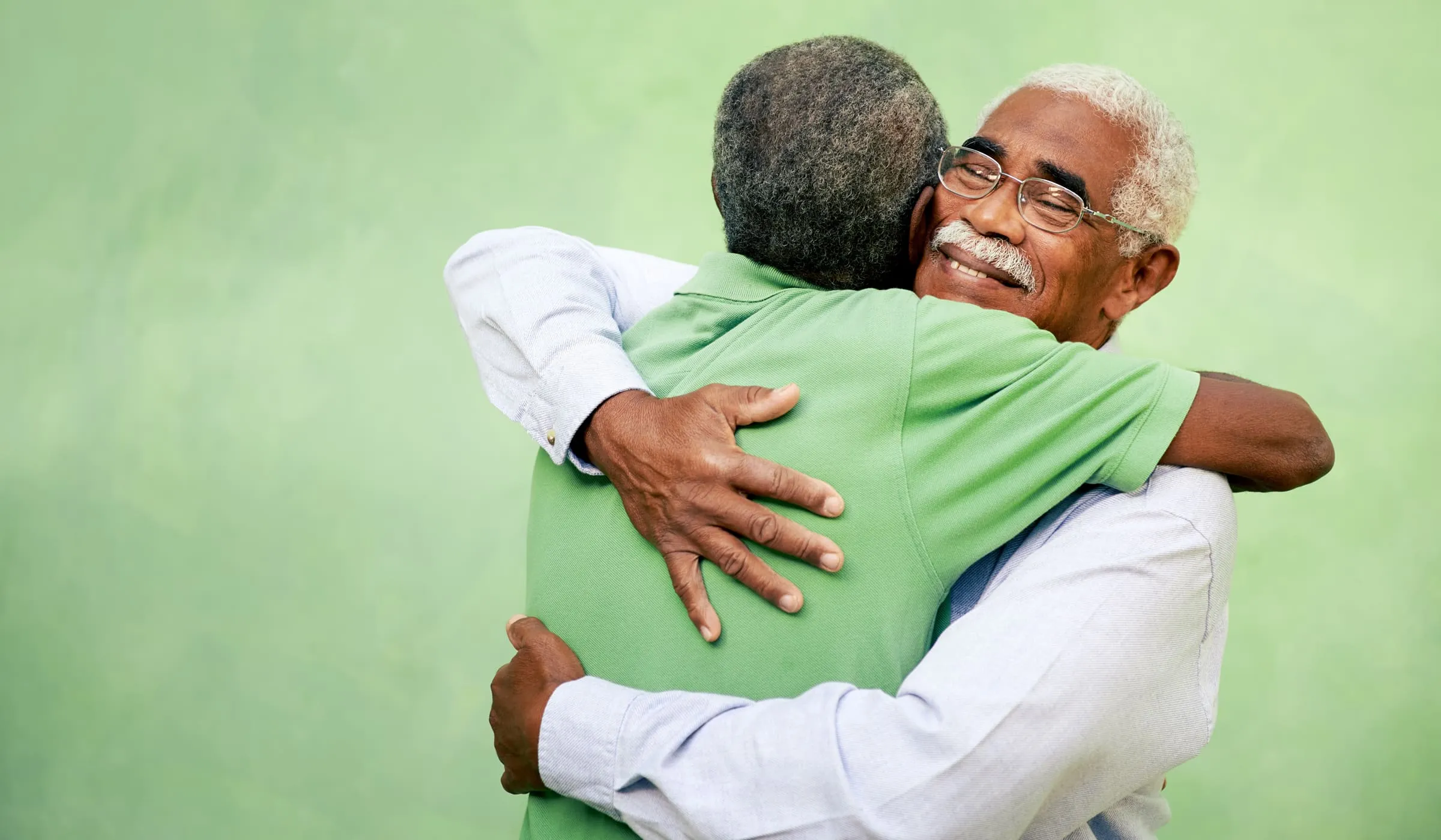 Two men hugging